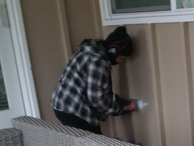 Professional electrician installing an exterior outlet in Wyoming